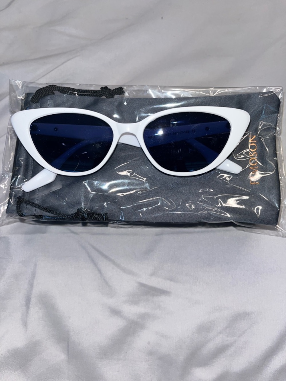 Retro-inspired "cat-eye" frames feature a white frosted finish & are  popular.